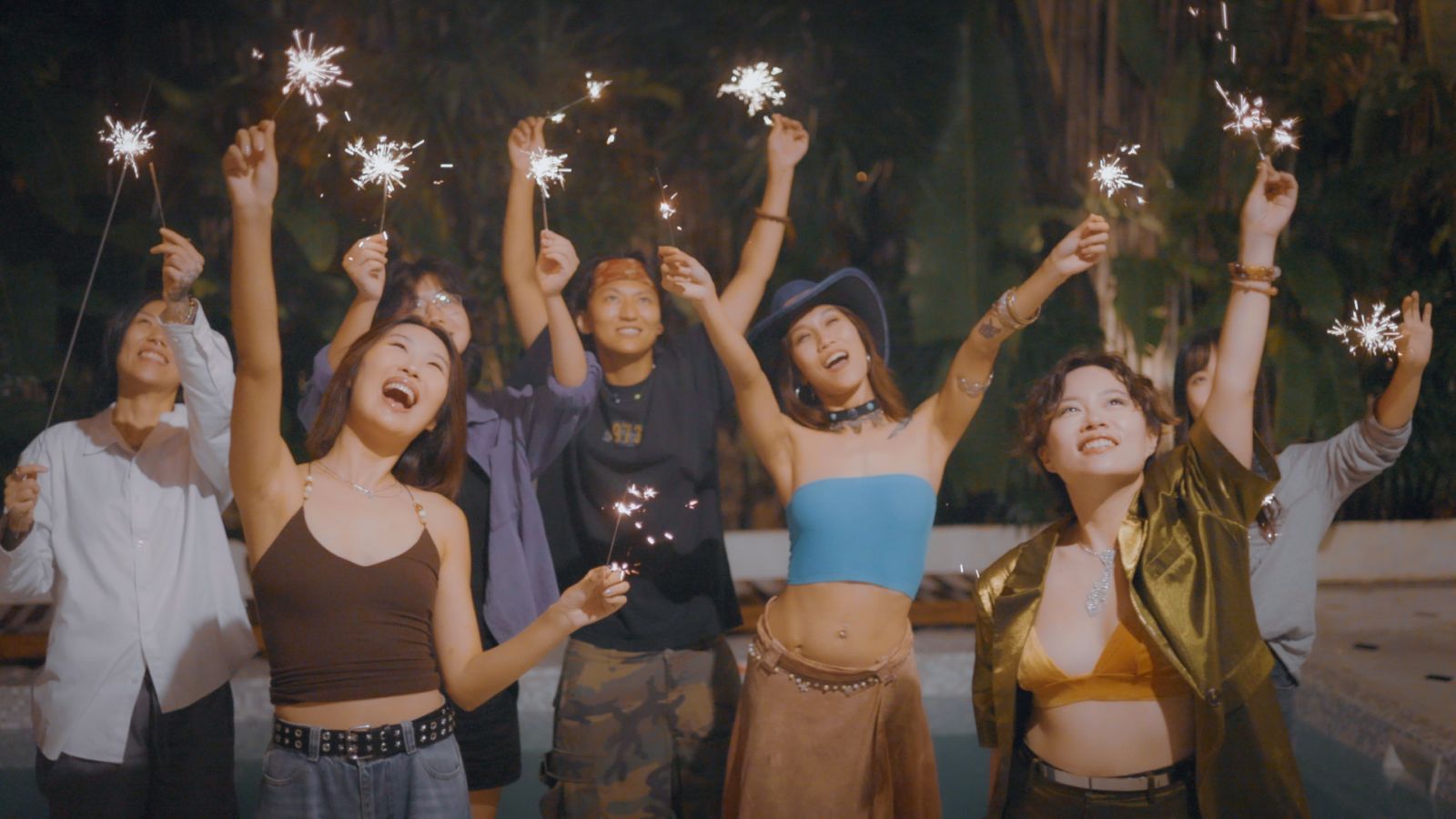 The cast of LeLaLes: Fluid Love celebrating with sparklers in Chiang Mai